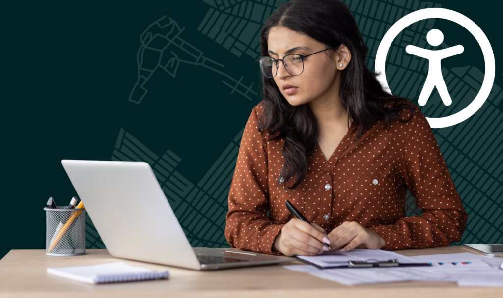 A graphic of a serious woman working at a laptop while reviewing documents, with an accessibility symbol in the background